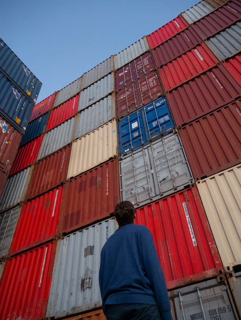 guy-looking-shipping-containers